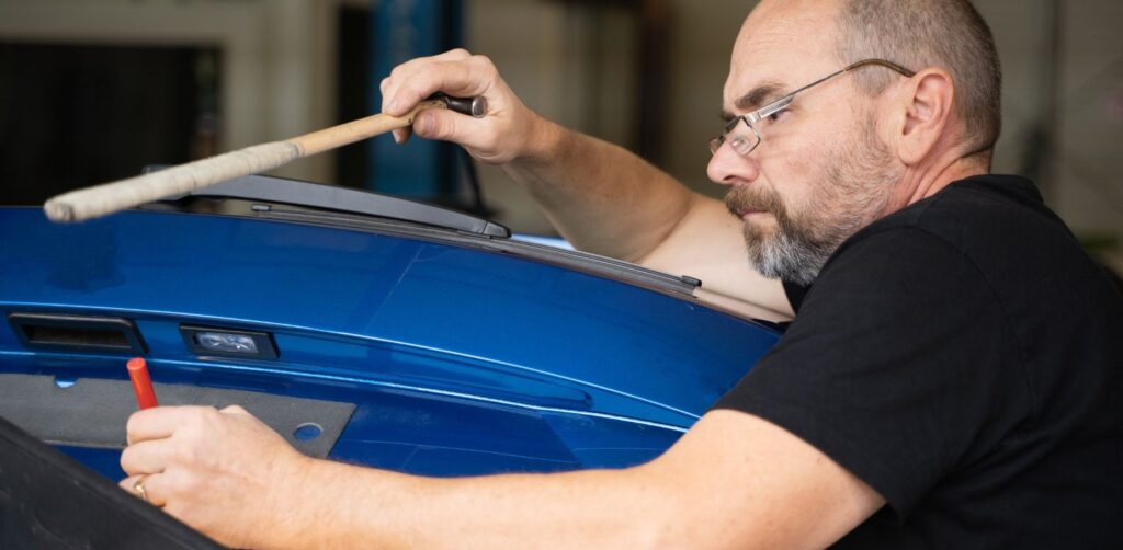 Dent repair cost comparison between paintless dent repair and traditional auto body repair